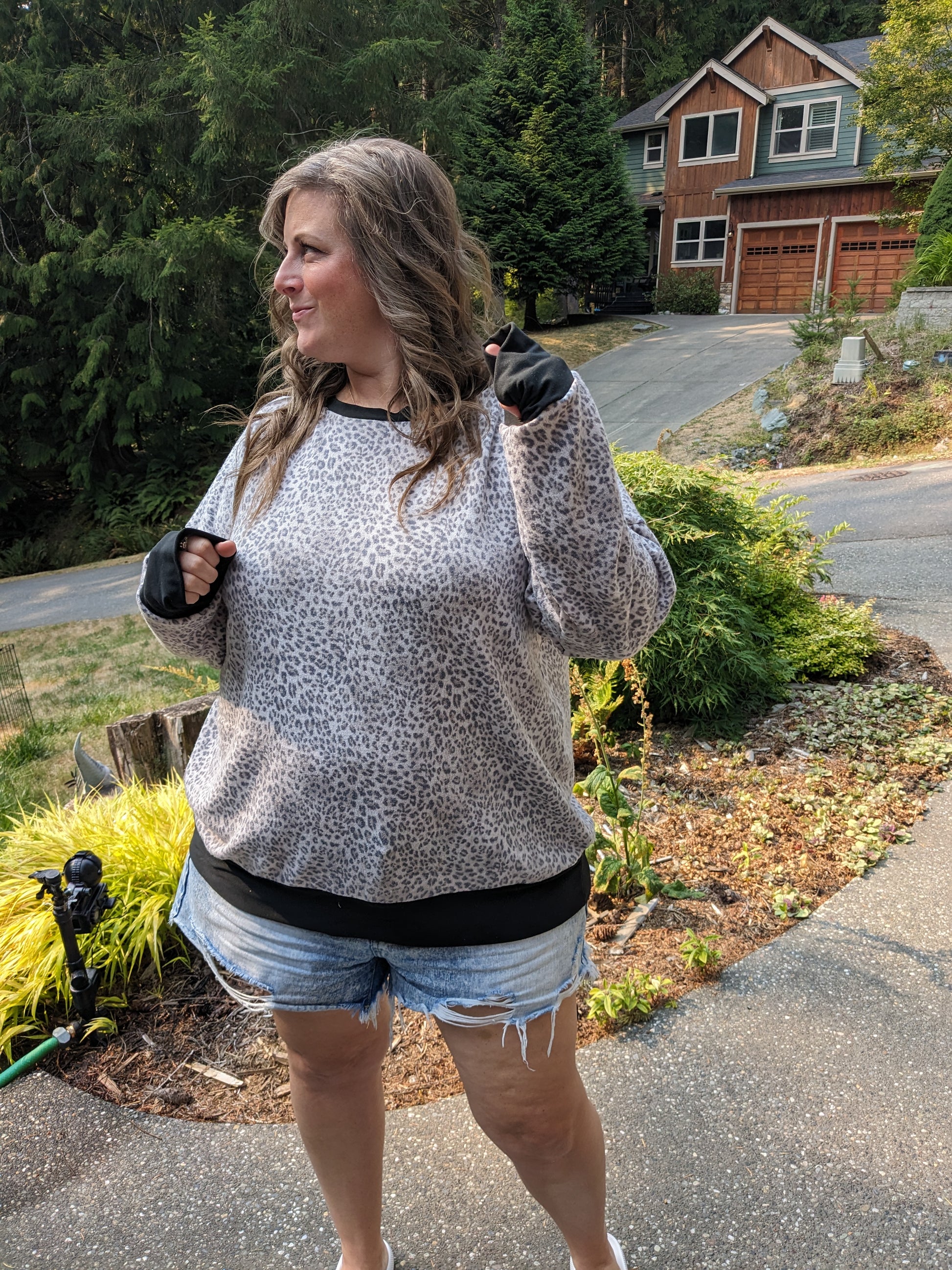 image of woman wearing cheetah sweatshirt