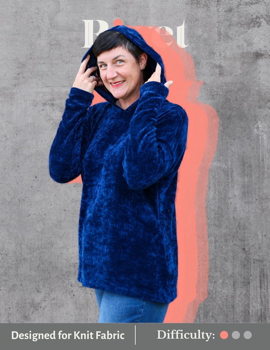 Image of woman wearing blue hood sweater