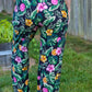 Image of green floral Rivet Patterns Pothos Pants being worn