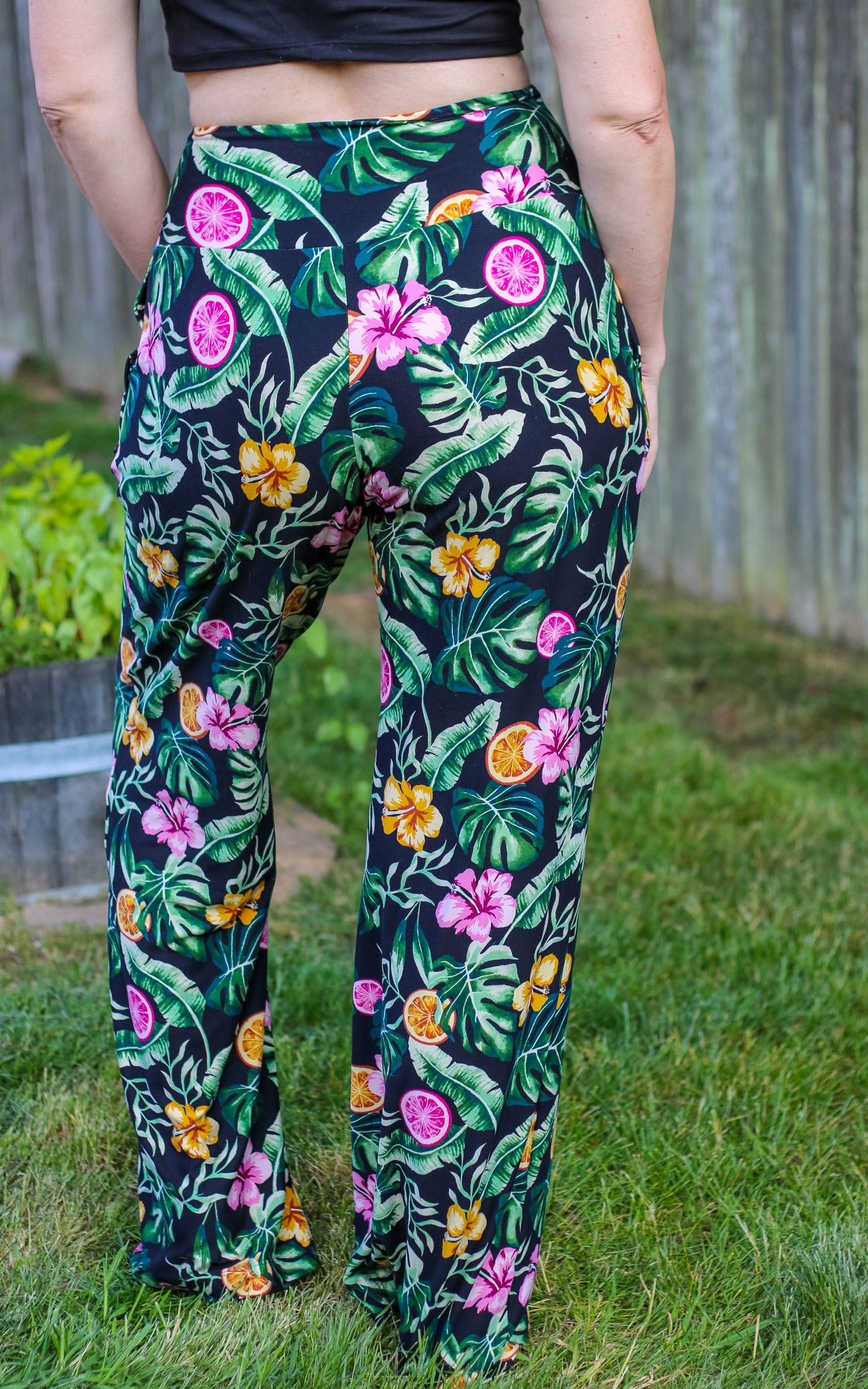Image of green floral Rivet Patterns Pothos Pants being worn