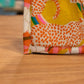 image of yellow cat Rivet Patterns Legato Wave Top Tote box corner