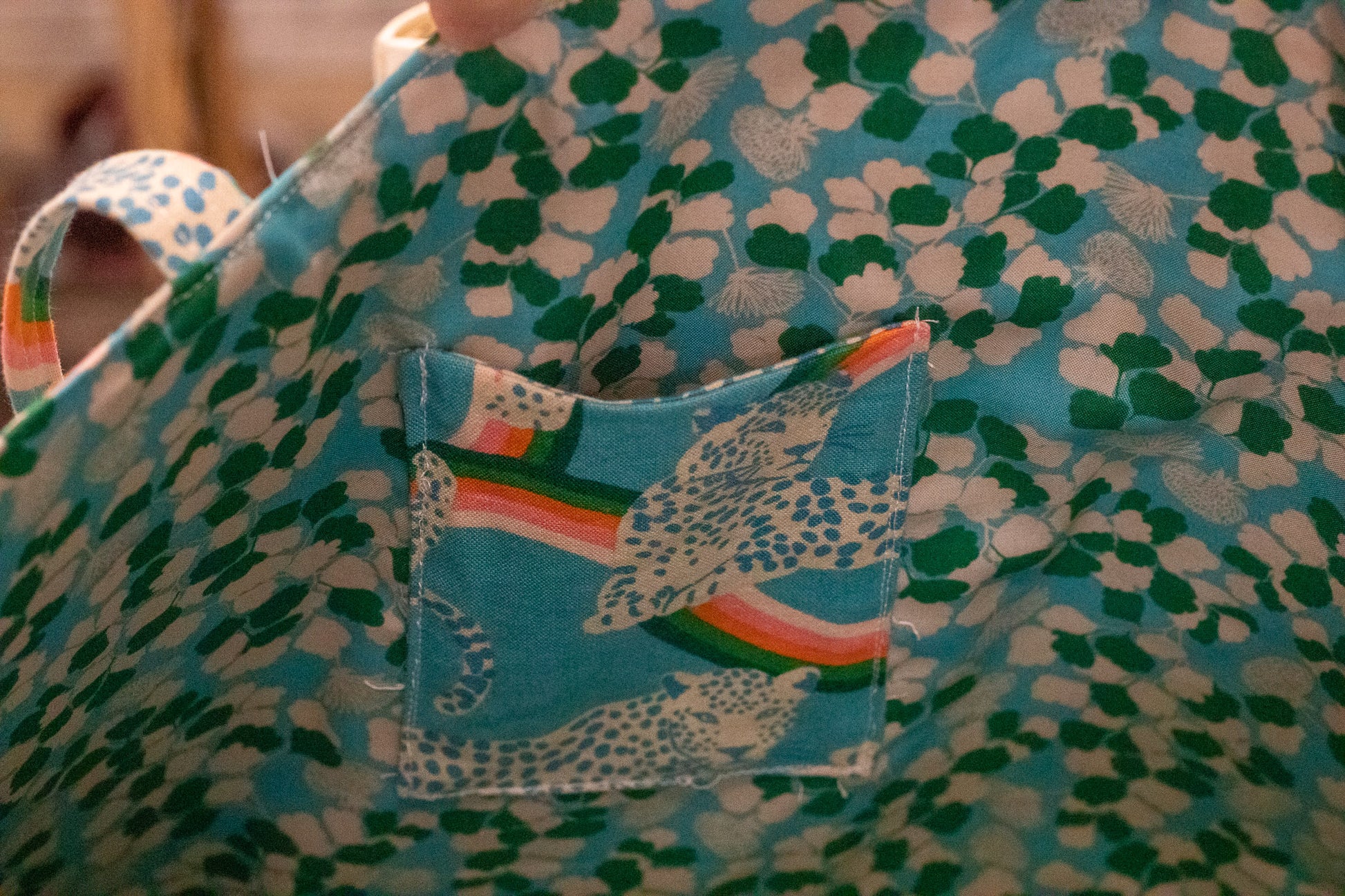 Image of blue rainbow Rivet Patterns Wave Top Tote inside pocket