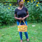 Image of yellow floral Rivet Patterns Wave Top Tote being held