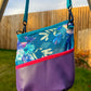 Image of purple and blue floral Rivet Allegro Crossbody Bag