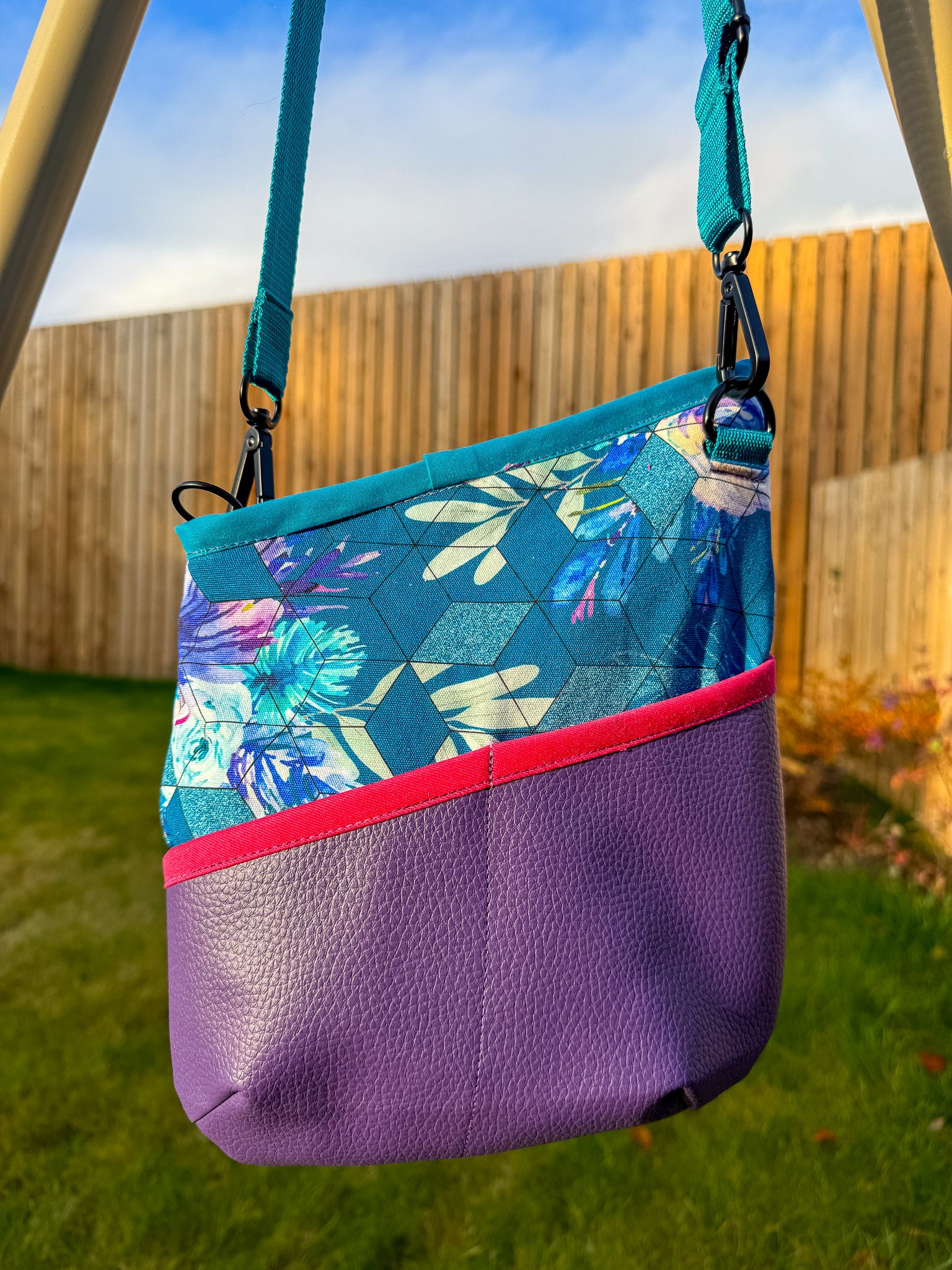 Image of purple and blue floral Rivet Allegro Crossbody Bag