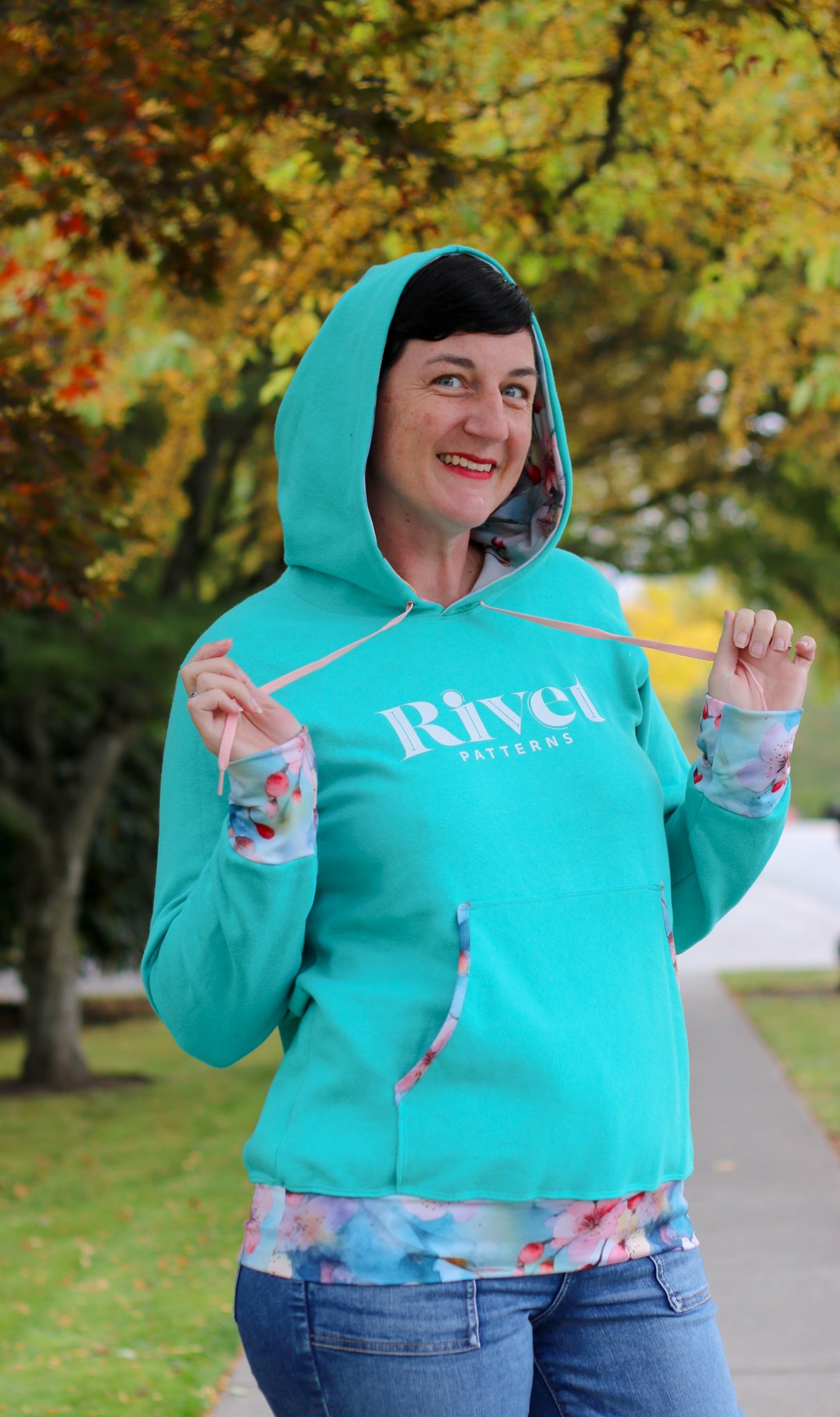 Image of green Rivet Patterns Alpine Sweatshirt with hood, pocket, cuffs and hem band.