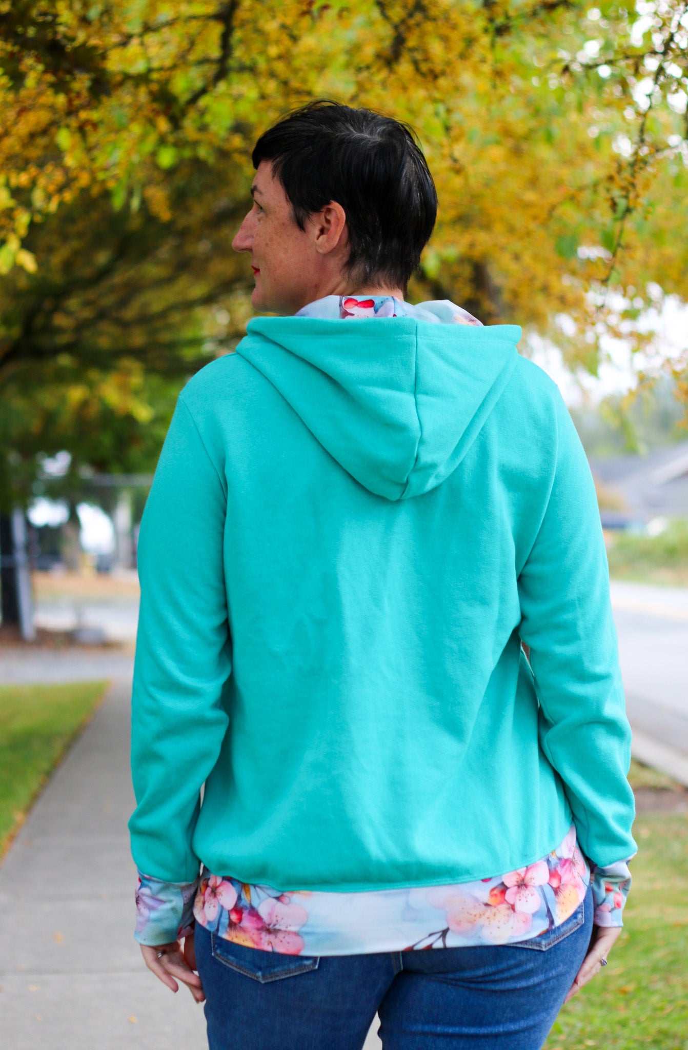 Image of green Rivet Patterns Alpine Sweatshirt with hood, pocket, cuffs and hem band.