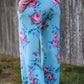 Image of blue floral Rivet Patterns Pothos Pants being worn pockets