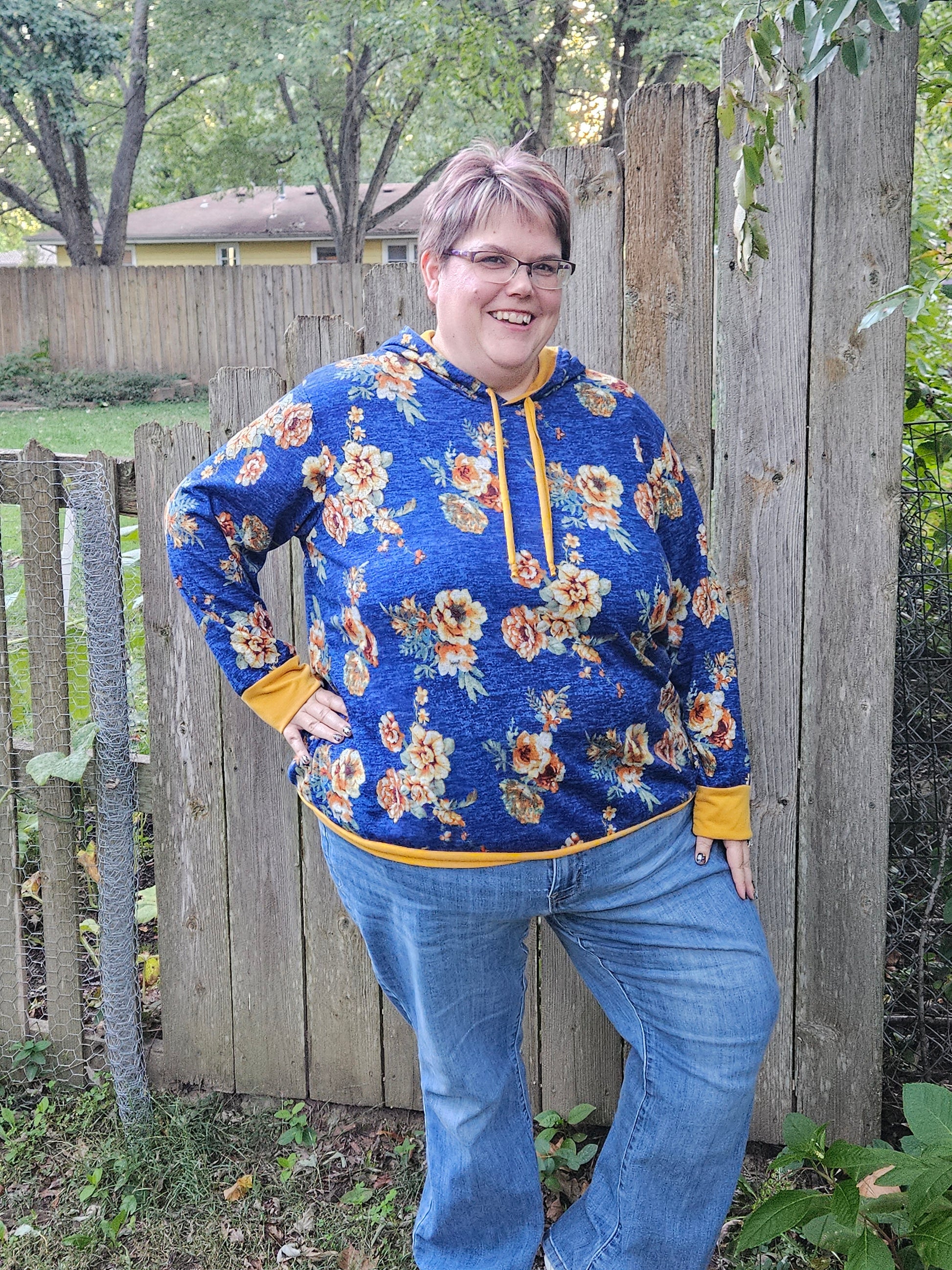 Image of blue floral Rivet Patterns Alpine Sweatshirt with hood, cuffs, and hem band.